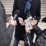 close-up-reporter-taking-interview